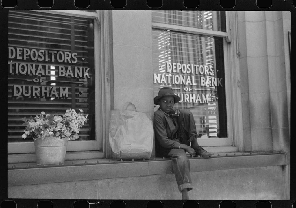 A young flower vendor in Durham, North Carolina, May 1940. Photo: Jack Delano.
