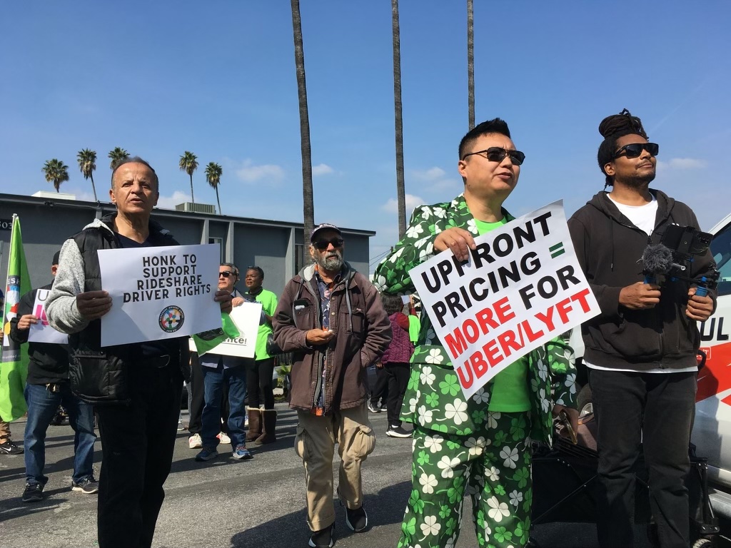 Rideshare Drivers United members protest in Los Angeles against pay cuts due to Uber's new algorithmic pricing, rolled out in early 2024. Photo courtesy of Rideshare Drivers United, 2024.	